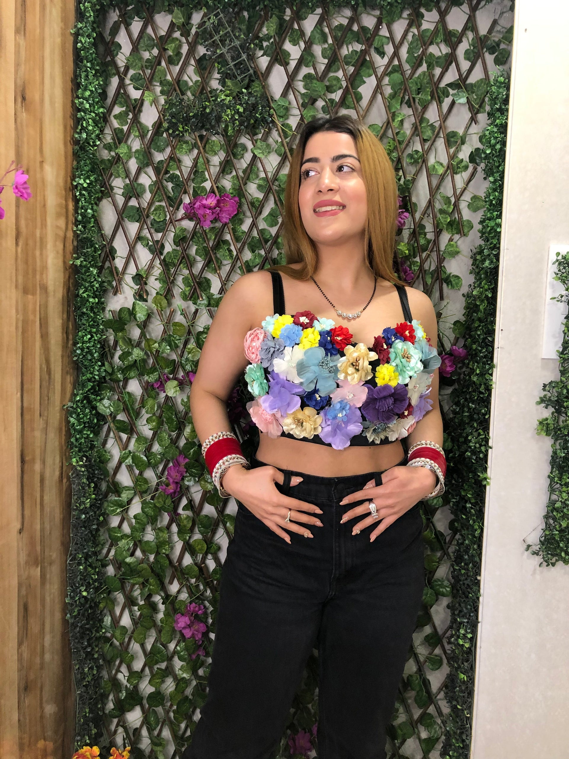  a woman wearing flower bustier with adjustable straps