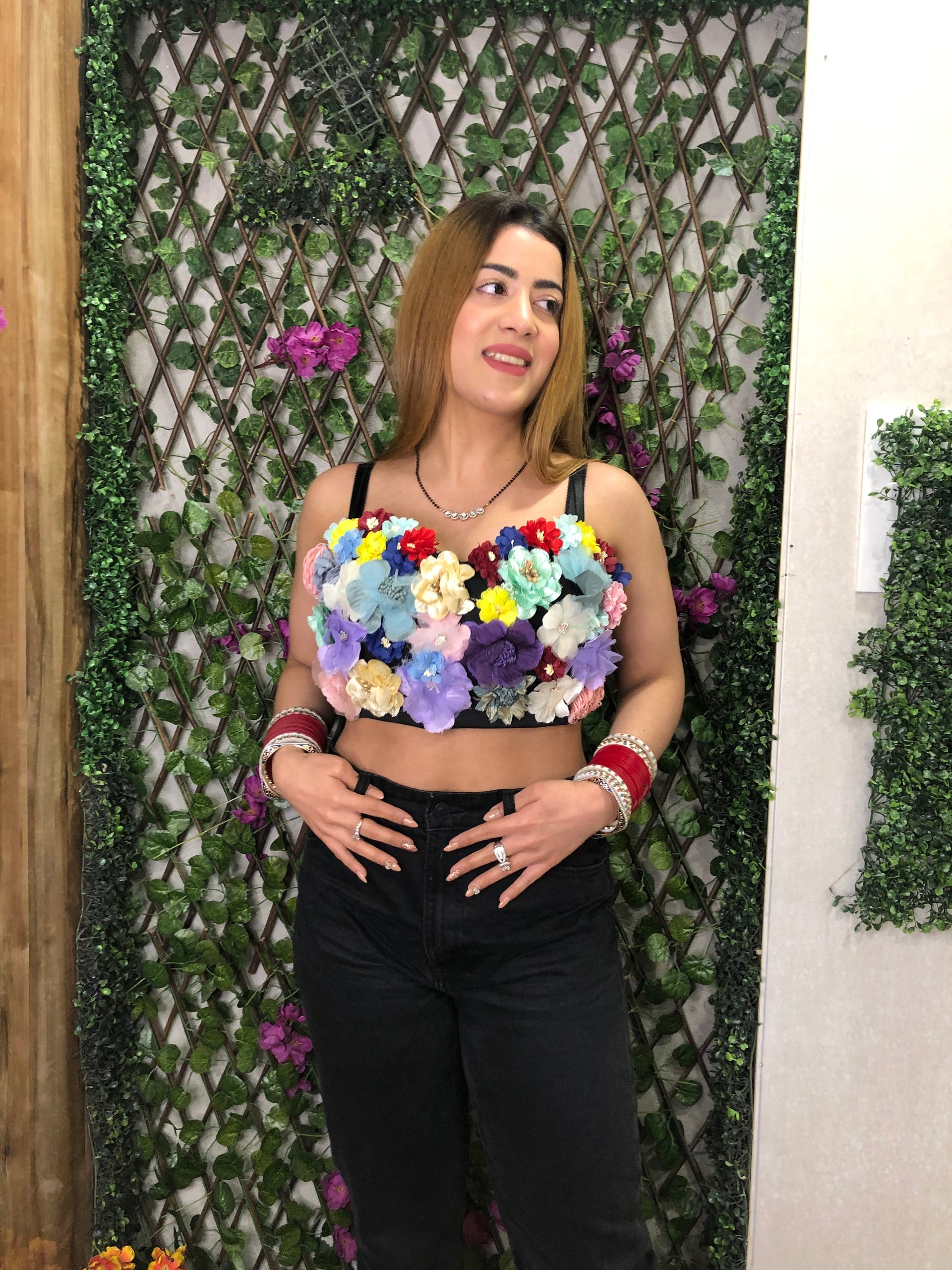  a woman wearing flower bustier with adjustable straps