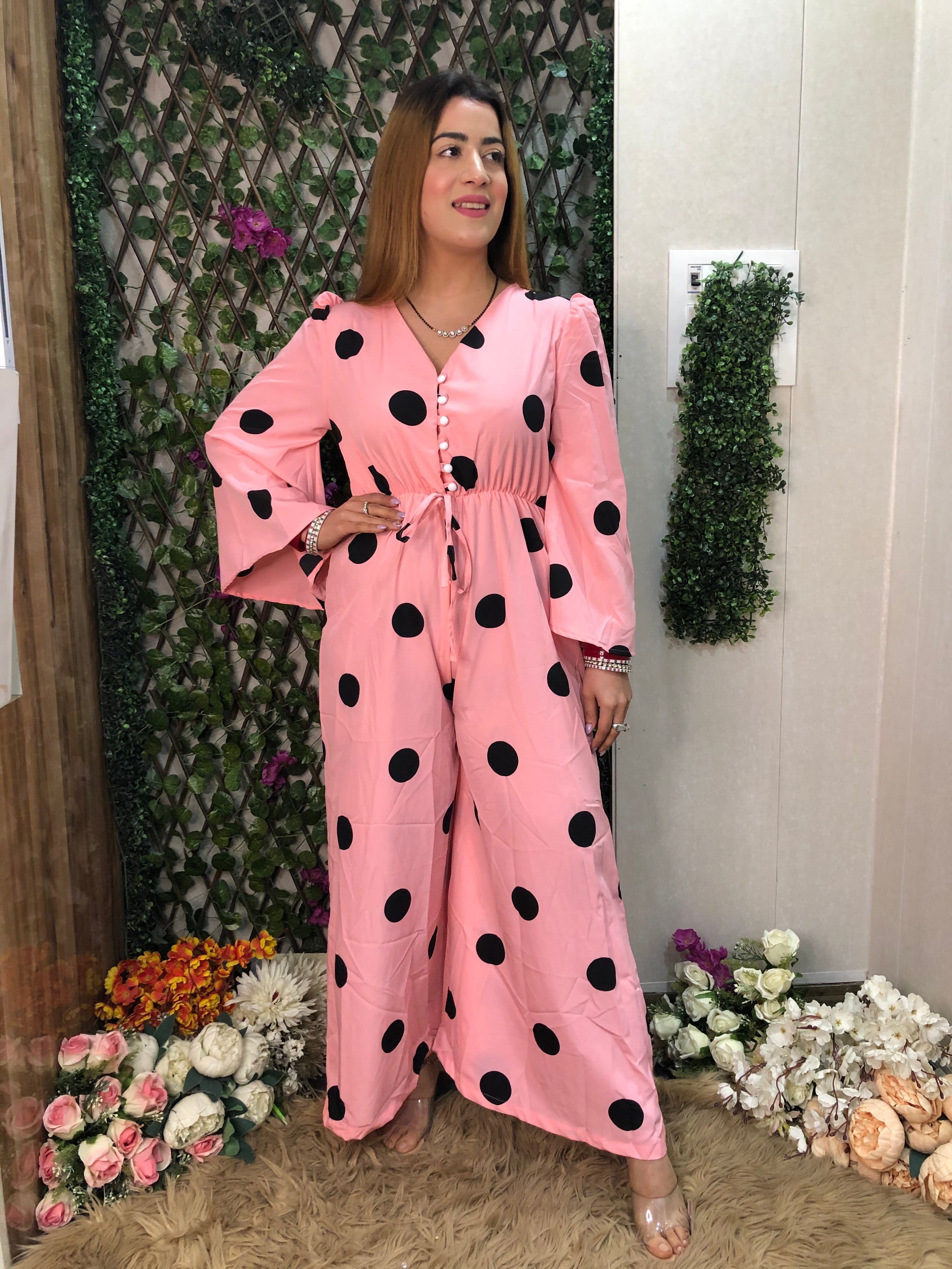 a woman wearing pink polka jumpsuit